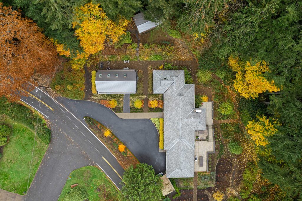 A drones-eye view of the property showing the studio, the home, and the landscape, all of which will be available to tour during The Portland Modern Home Tour.