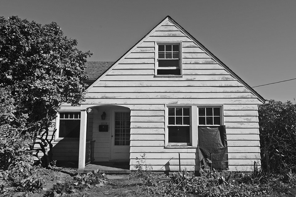 Photo of the original farmhouse on the site.