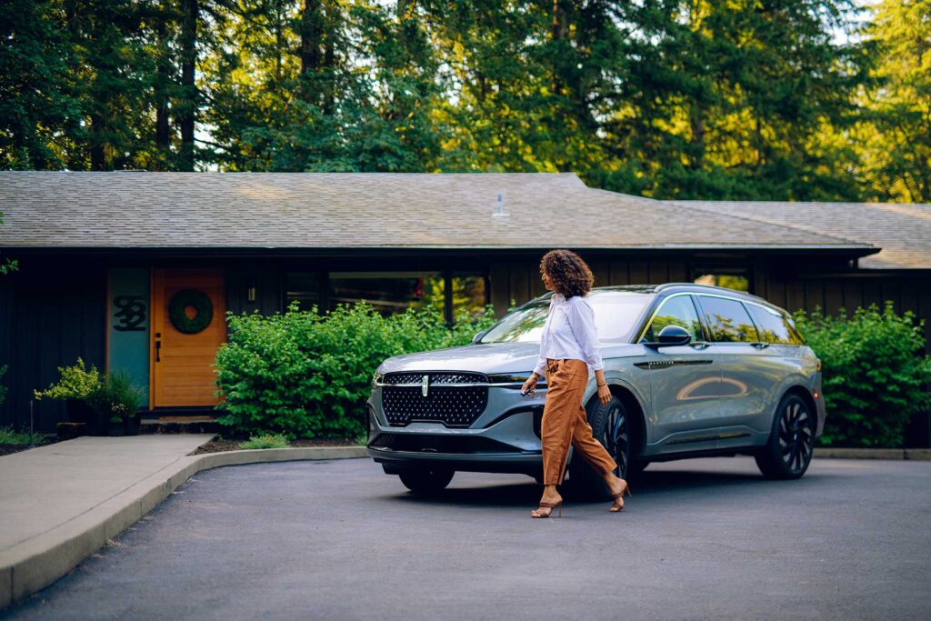 The model walks in front of the Lincoln Nautilus during the shoot of the Courtesy Lincoln commercial.