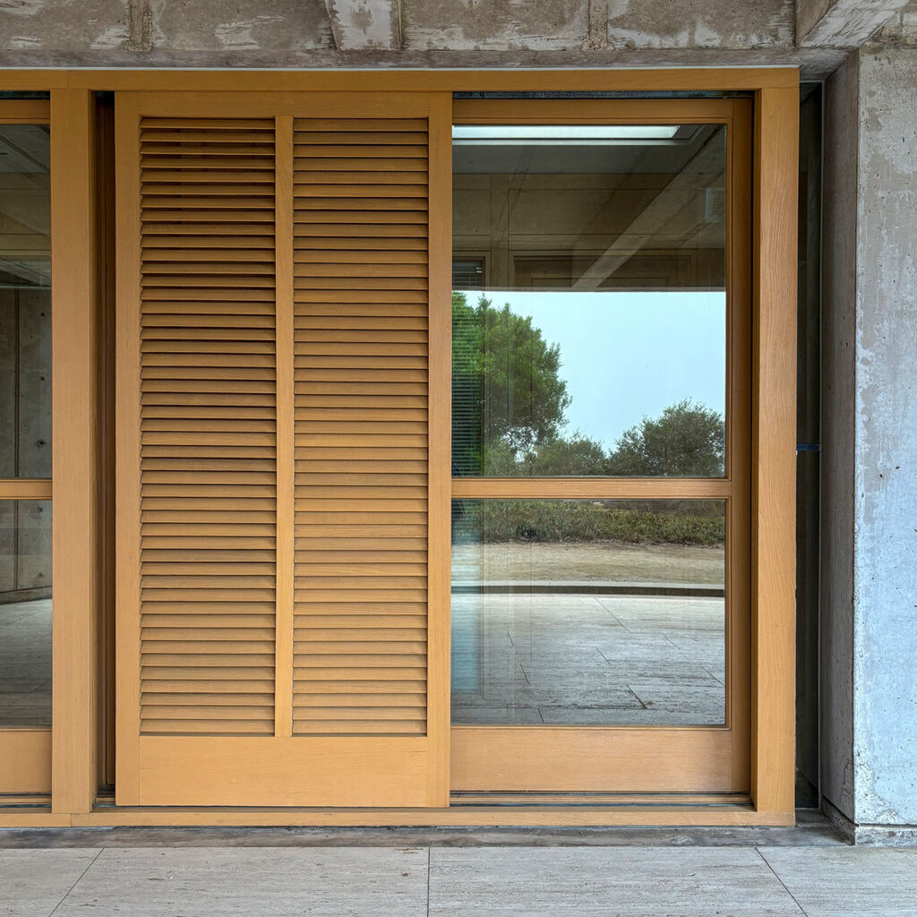 Close up view of a teak sliding door at the Salk Institute.