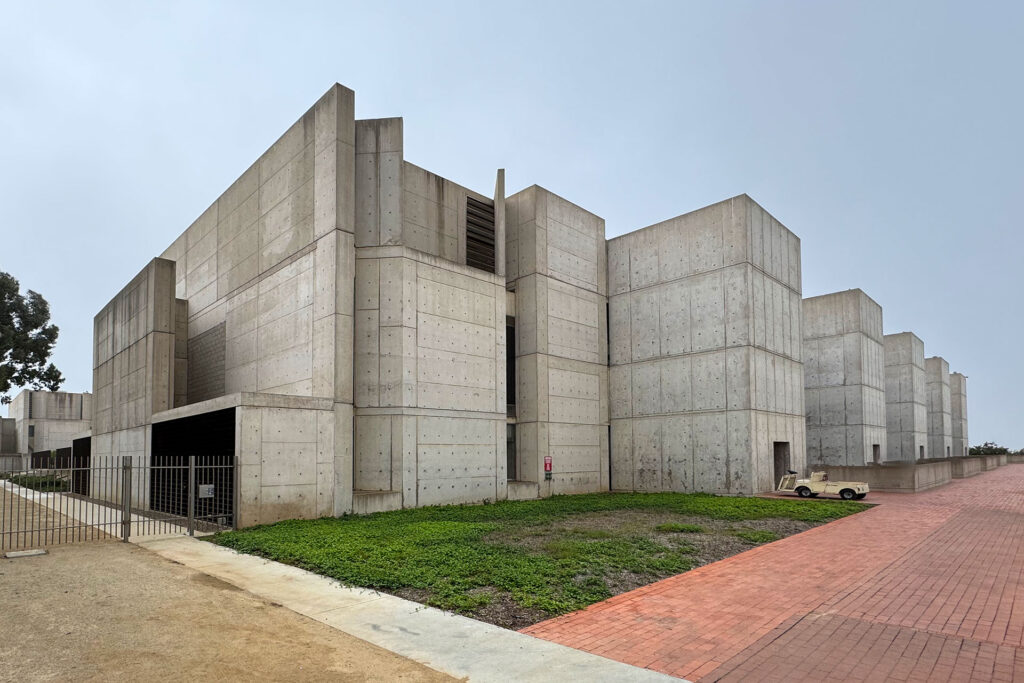 Exterior view of the back of the north side of the building showing the concrete service towers.