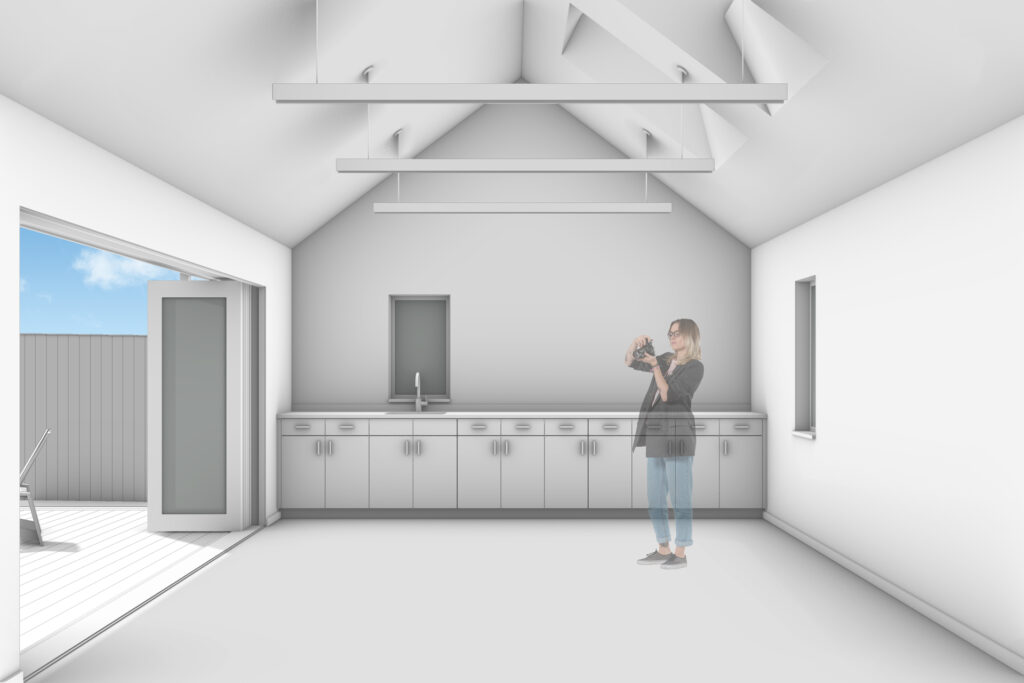 A 3d rendering of the interior of the new artist studio showing the vaulted ceiling and open work space.